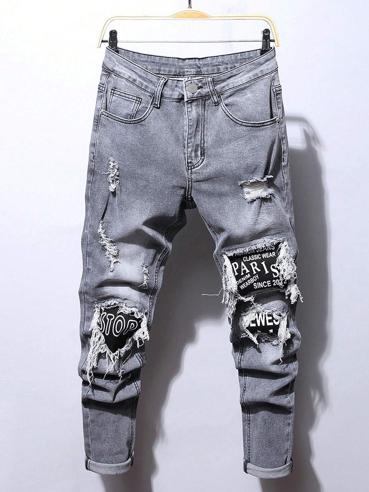 Männer Jeans mit Stonewashed-Effekt und Buchstaben-Patches