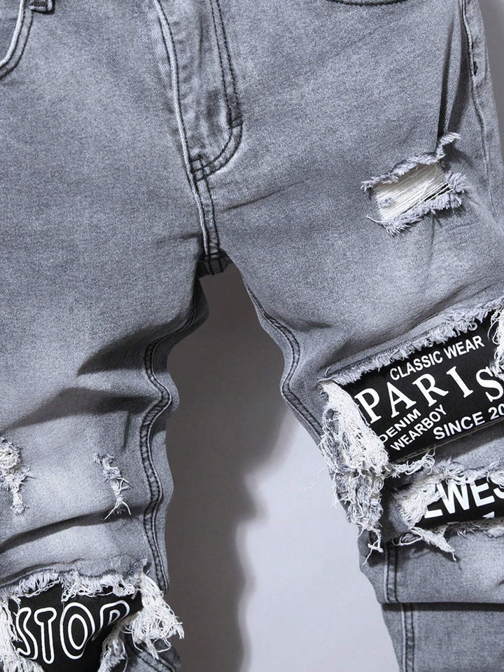 Männer Jeans mit Stonewashed-Effekt und Buchstaben-Patches