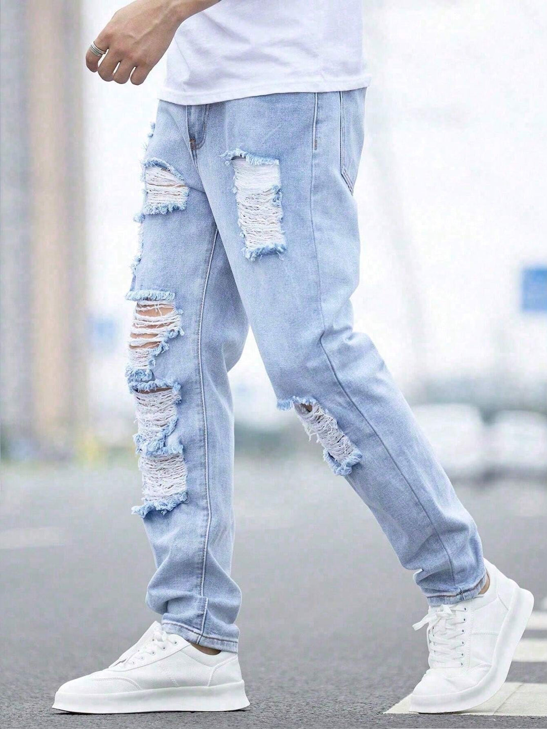 Männer Jeans mit zerrissener, ausgefranster Baumwolle und Cut-Outs